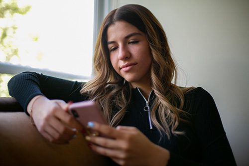 young woman looking at phone